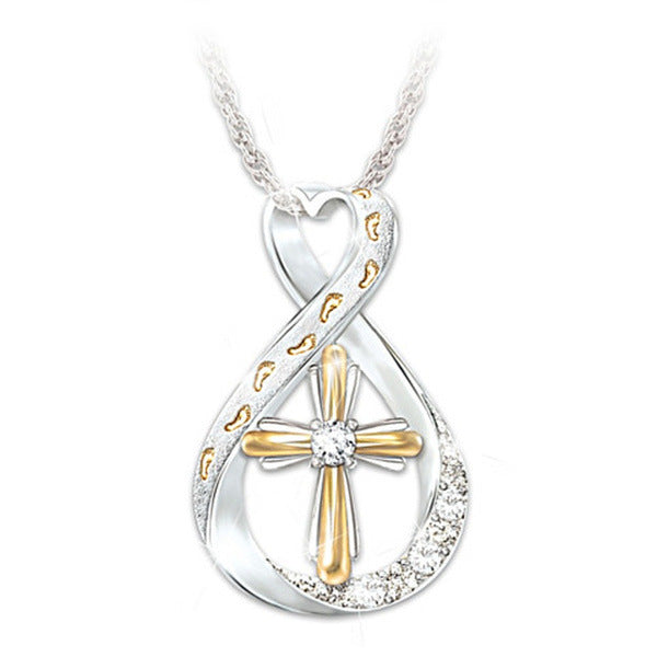 ZÉLVARÈ Two-Tone Cross Pendant Necklace – product photo