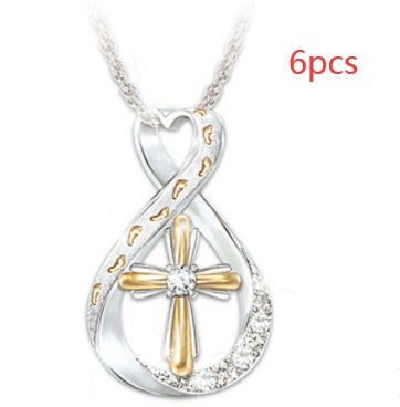 ZÉLVARÈ Two-Tone Cross Pendant Necklace – product photo