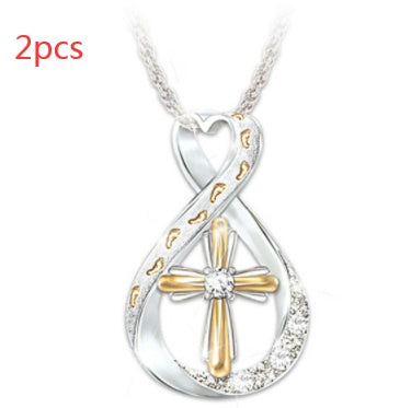 ZÉLVARÈ Two-Tone Cross Pendant Necklace – product photo