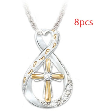 ZÉLVARÈ Two-Tone Cross Pendant Necklace – product photo