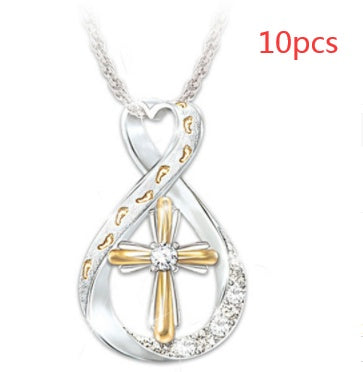 ZÉLVARÈ Two-Tone Cross Pendant Necklace – product photo